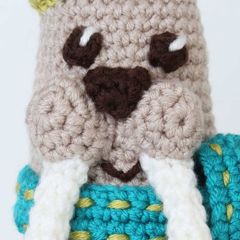 Picture of crochet walrus face embroidered detail