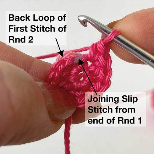 Picture of Rnd 2 completed, identifying the slip stitch from the end of Rnd 1