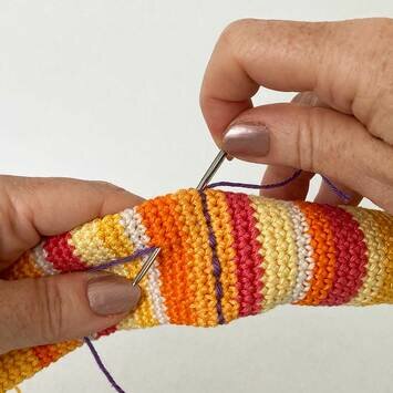 Picture of Fig 15 - bringing yarn tails pout of piece