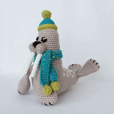 Picture of completed crochet walrus from front left