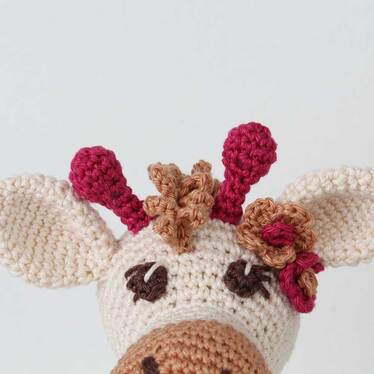 Picture of Girl Giraffe - crochet flowers at base of ear