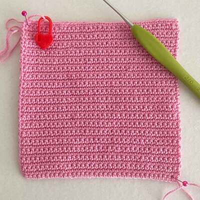 Picture of crochet tension square worked in rows of UK dc (US sc)