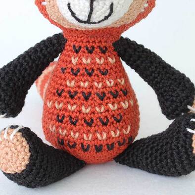Crochet Red Panda - picture showing v stitch embroidered detail on front of Body