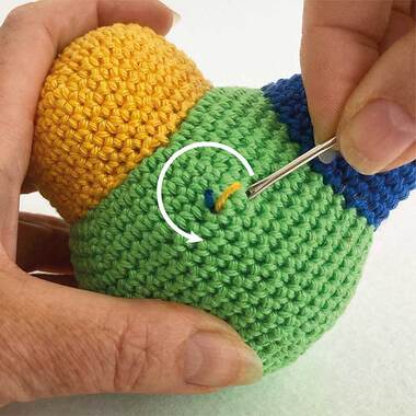 Picture of yarn ends being worked into amigurumi